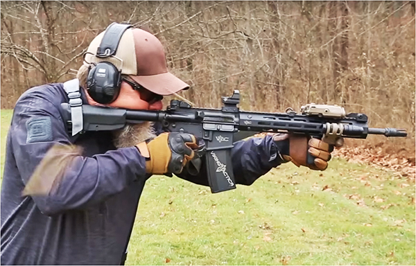 Cheek weld Kyle Lamb of Viking Tactics demonstrating proper cheek weld in the context of butt stock placement.