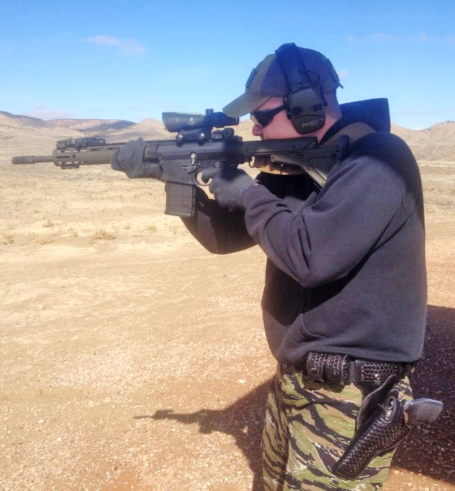 Novelist Mike Kupari putting rounds downrange with proper cheekweld.